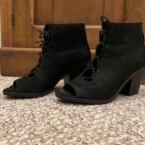 Black lace up, opened toe Eileen Fisher booties.
